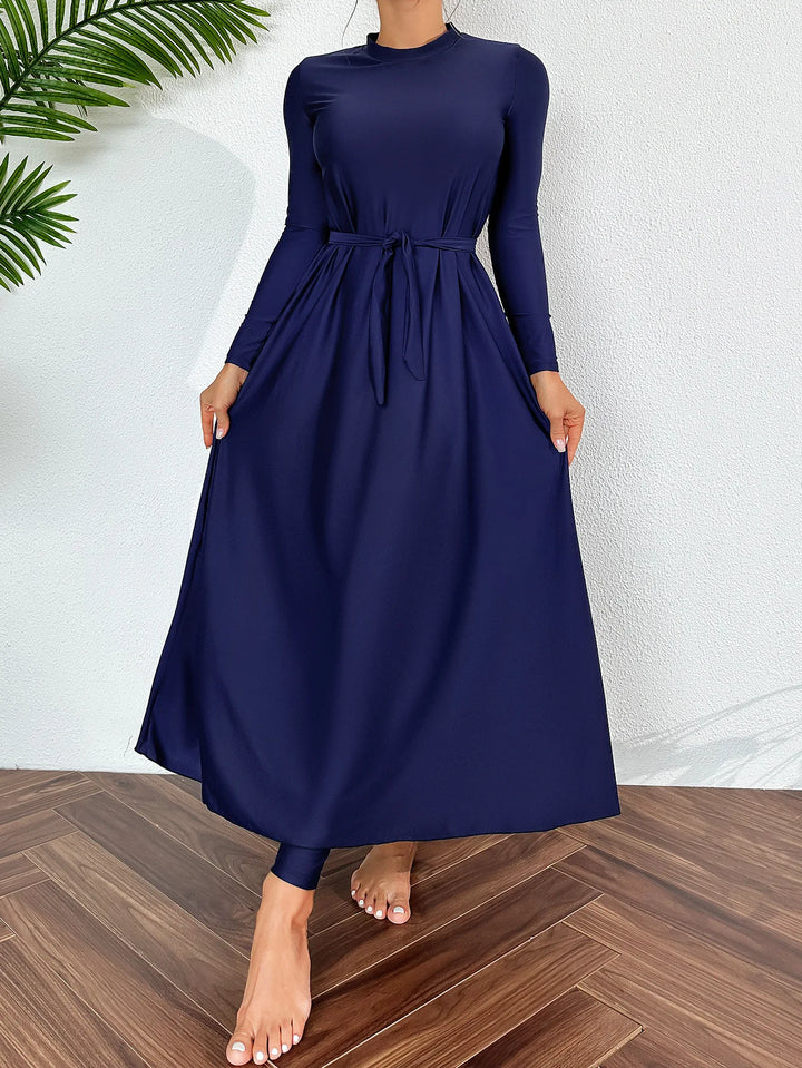 AzureFlow modest burkini set displayed on mannequin against beach background