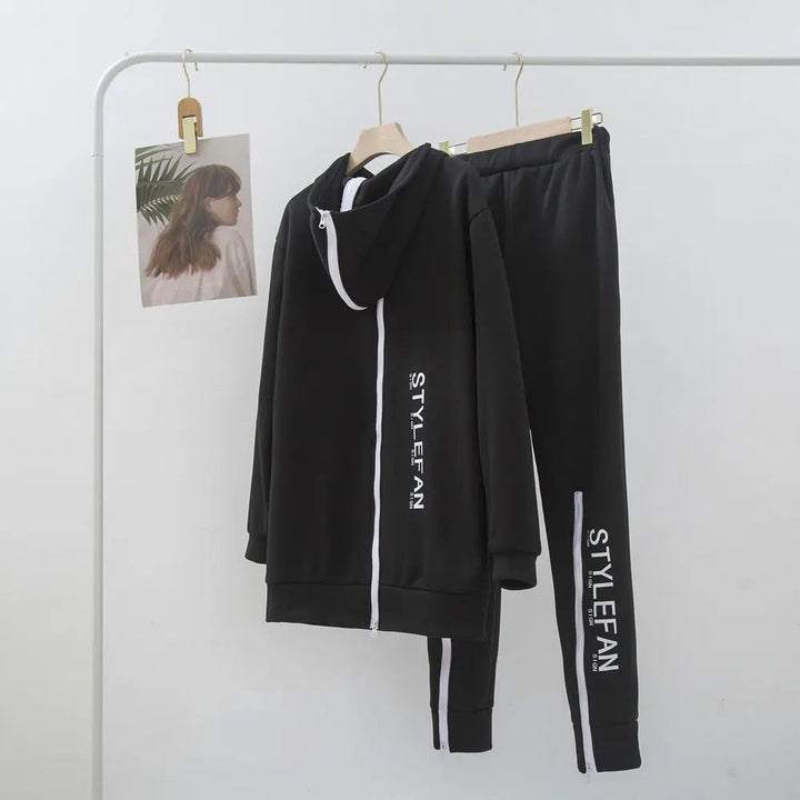 Black tracksuit with '' branding on a white background