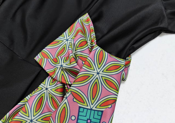Colorful patterned fabric with a black background