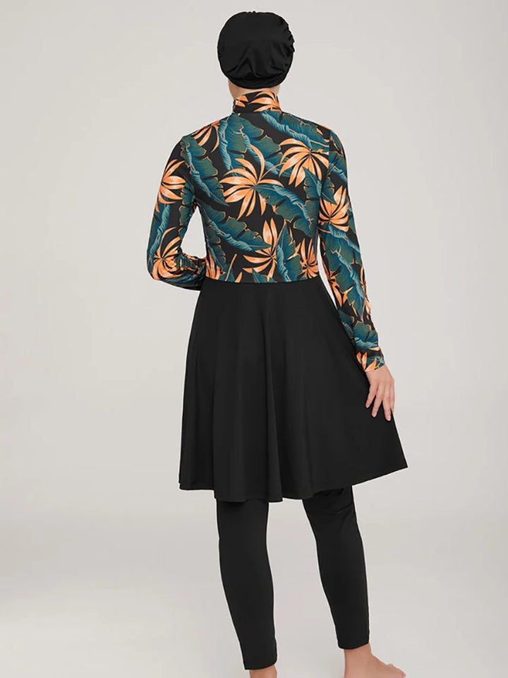 Colorful shell-patterned tropical top with black swim pants and matching hijab