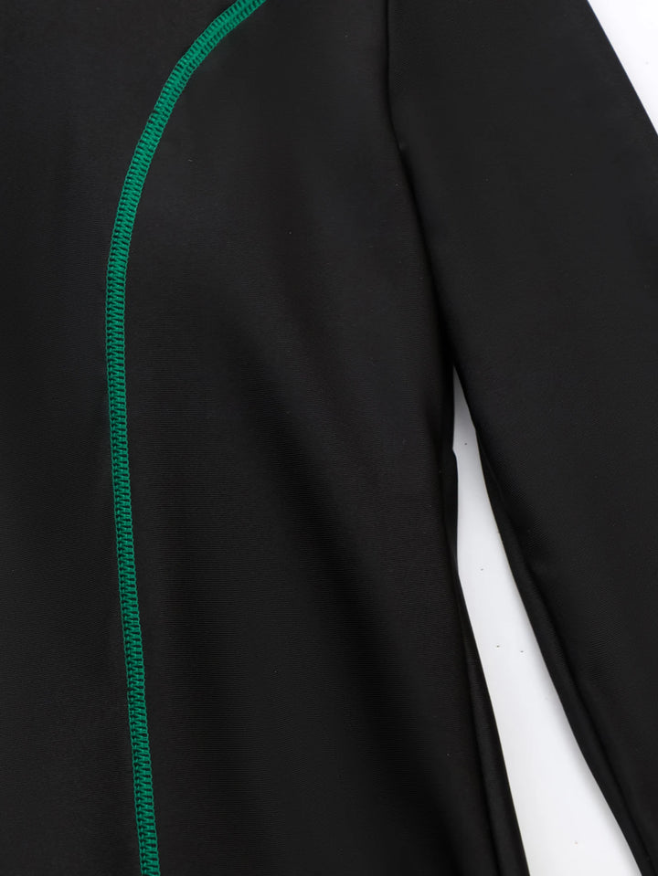 Flat lay of swim tunic, green leggings, and hijab on white background