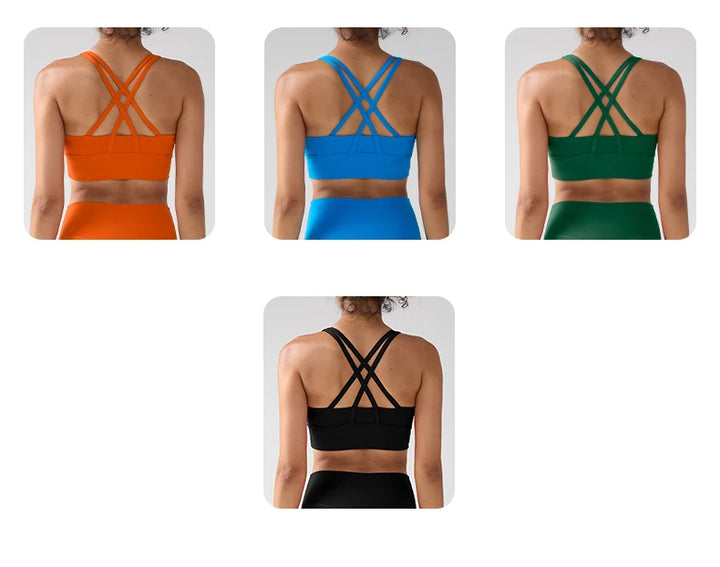 Four different colored sports bras shown from the back on a white background.