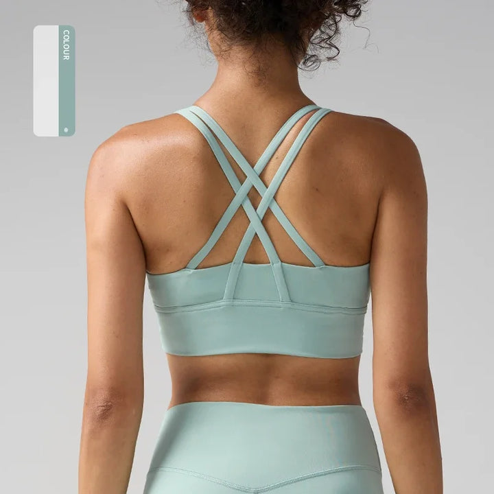 Light blue sports bra and leggings on a neutral background