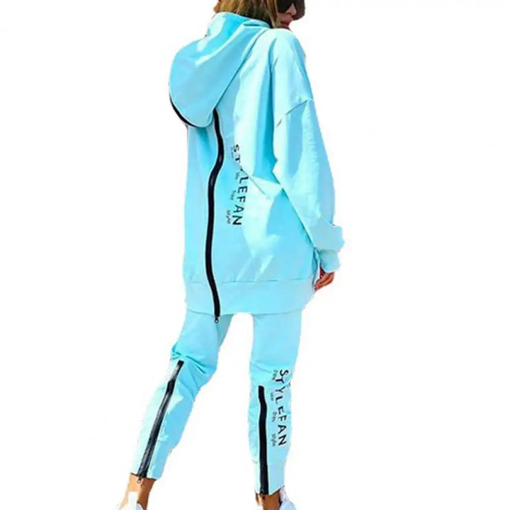 Light blue tracksuit with black accents on a white background