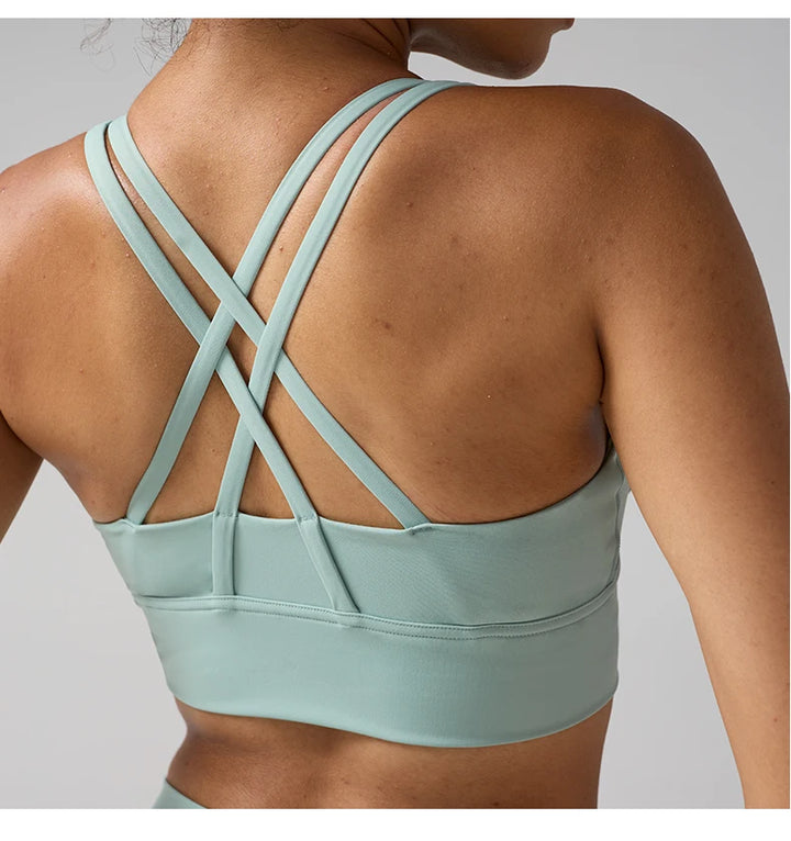Light green sports bra with criss-cross straps 