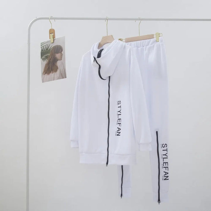White tracksuit with 'STYLEFAN' branding on a rack against a white wall.