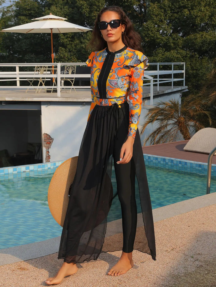 Model adjusting sheer black skirt over full-length black swim pants