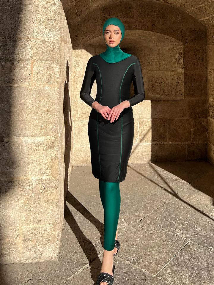 Modest swimwear with black long sleeve tunic and green hijab