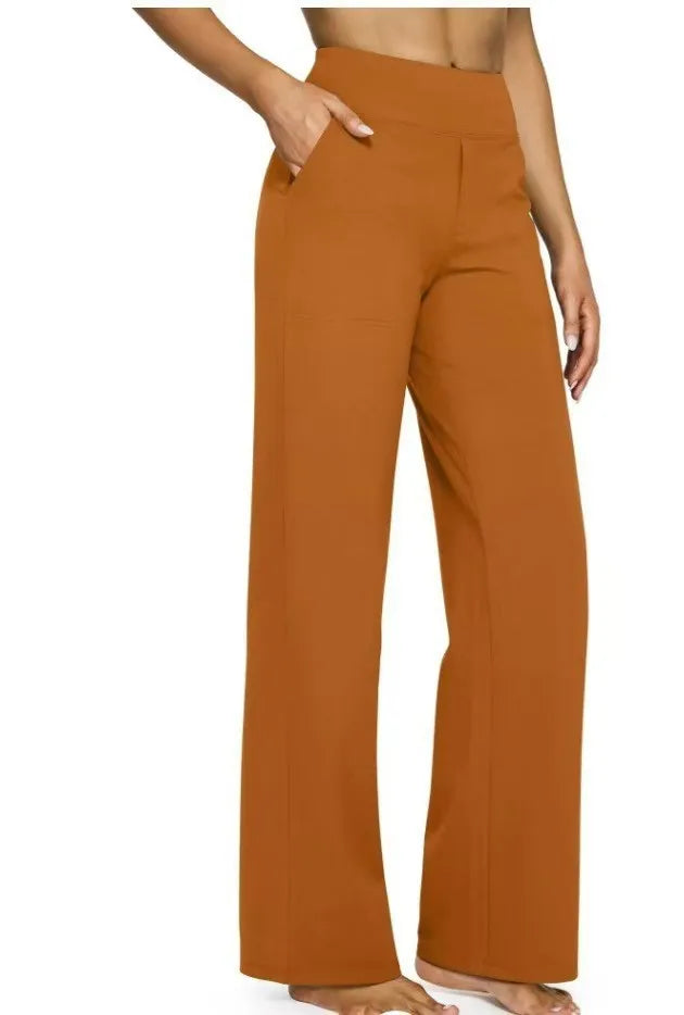 Orange wide-leg pants worn by a person on a white background