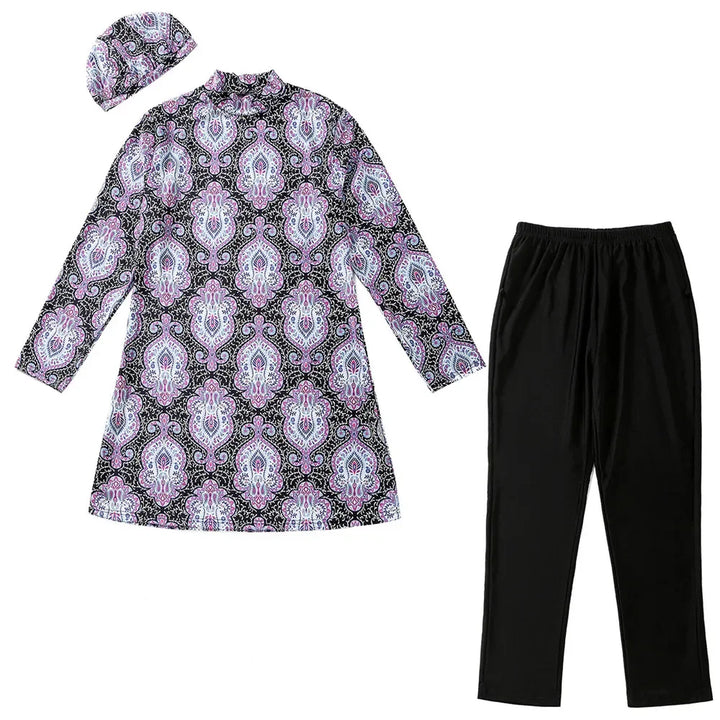 Patterned burkini with long sleeves, black pants, and matching headscarf on a white background
