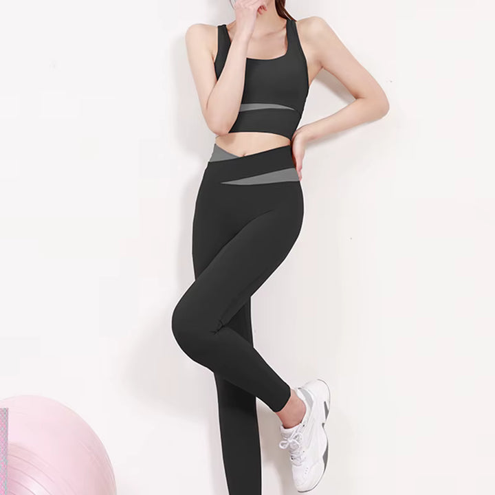 Person wearing a black athletic outfit on a white background