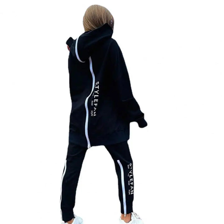 Person wearing a black tracksuit with 'STYLEFAN' branding on a white background
