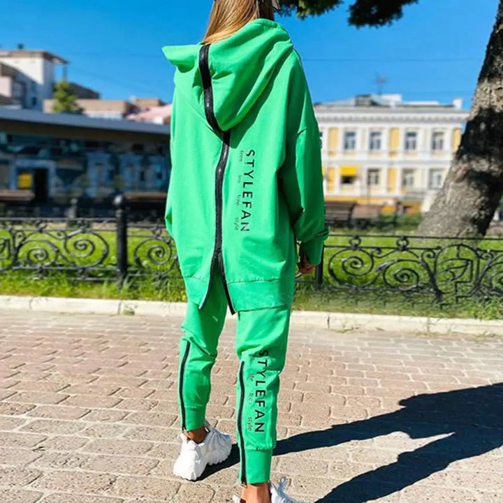 Person wearing a green tracksuit with 'STYLEFAN' branding in an outdoor setting.