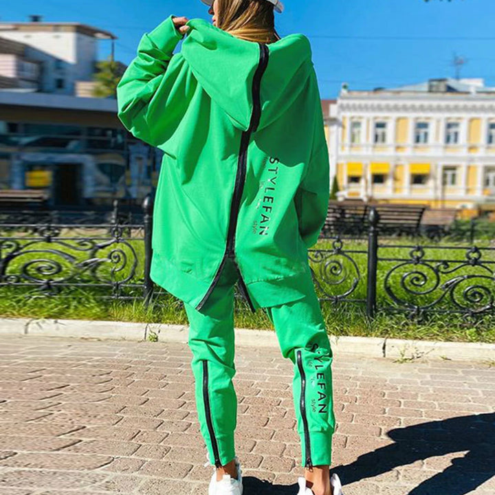 Person wearing a green tracksuit with 'STYLeFAN' branding in an urban setting.