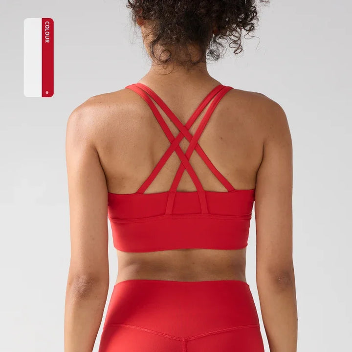 Red sports bra and leggings on a person with a white background