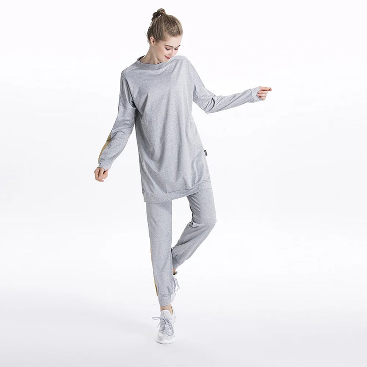 Side view of gray athletic tunic falling to the hips for modest coverage