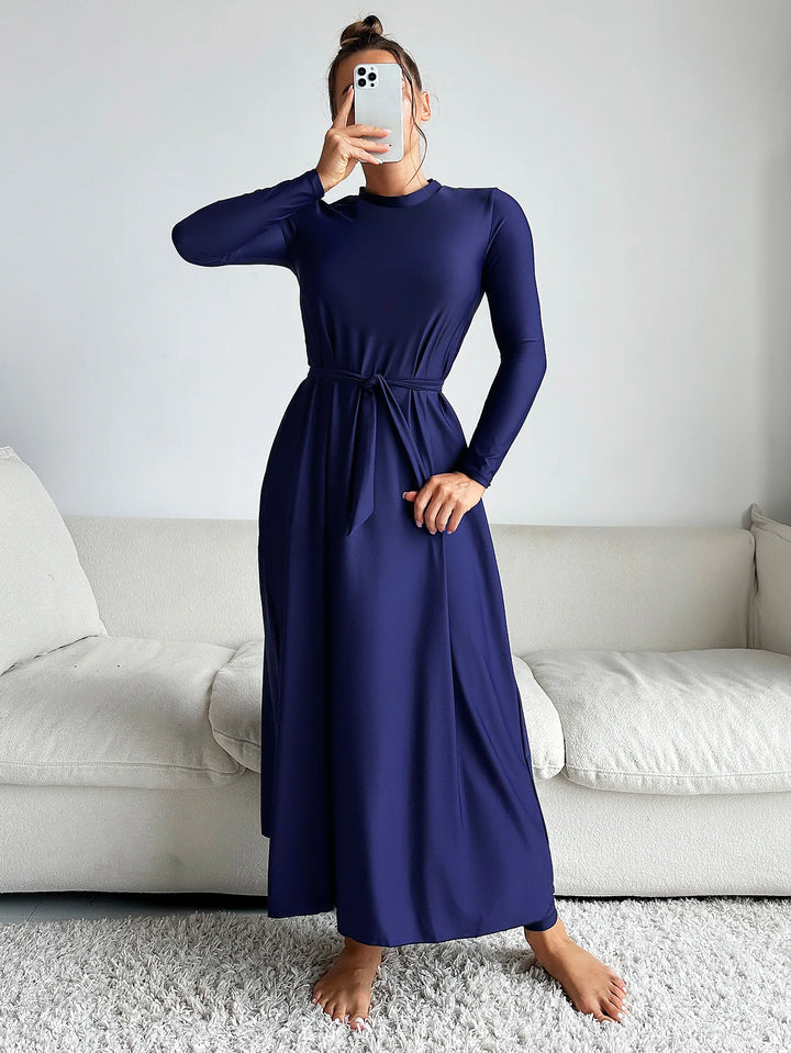 Side view of navy long-sleeve burkini top showing waist belt detail