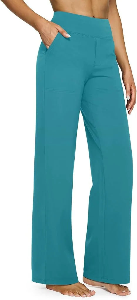 Teal pants worn by a person on a neutral background