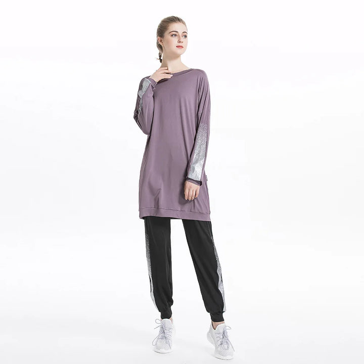 Tunic top and leggings folded together in black, gray, and purple color options