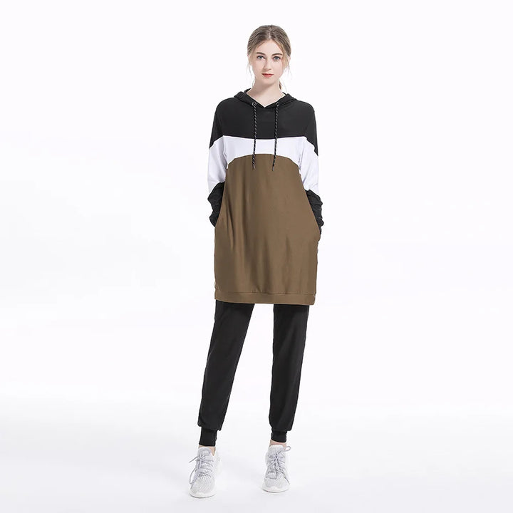 Woman wearing a black, white, and brown color modest activewear