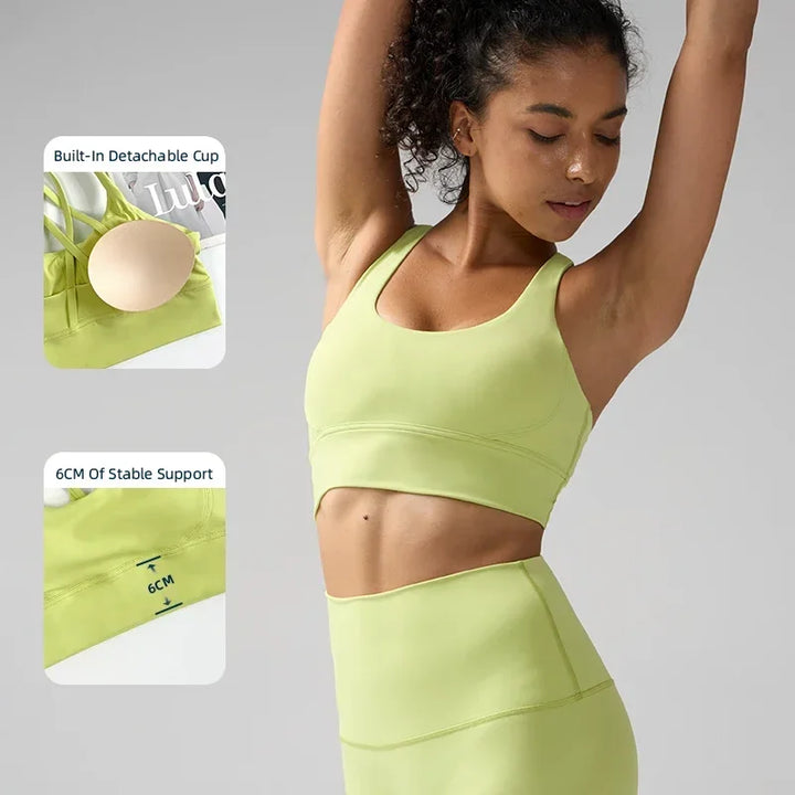 Woman wearing a green sports bra and leggings with inset images highlighting features.