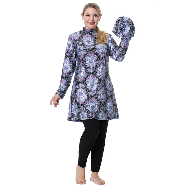 Woman wearing a long-sleeve patterned top and black leggings on a white background