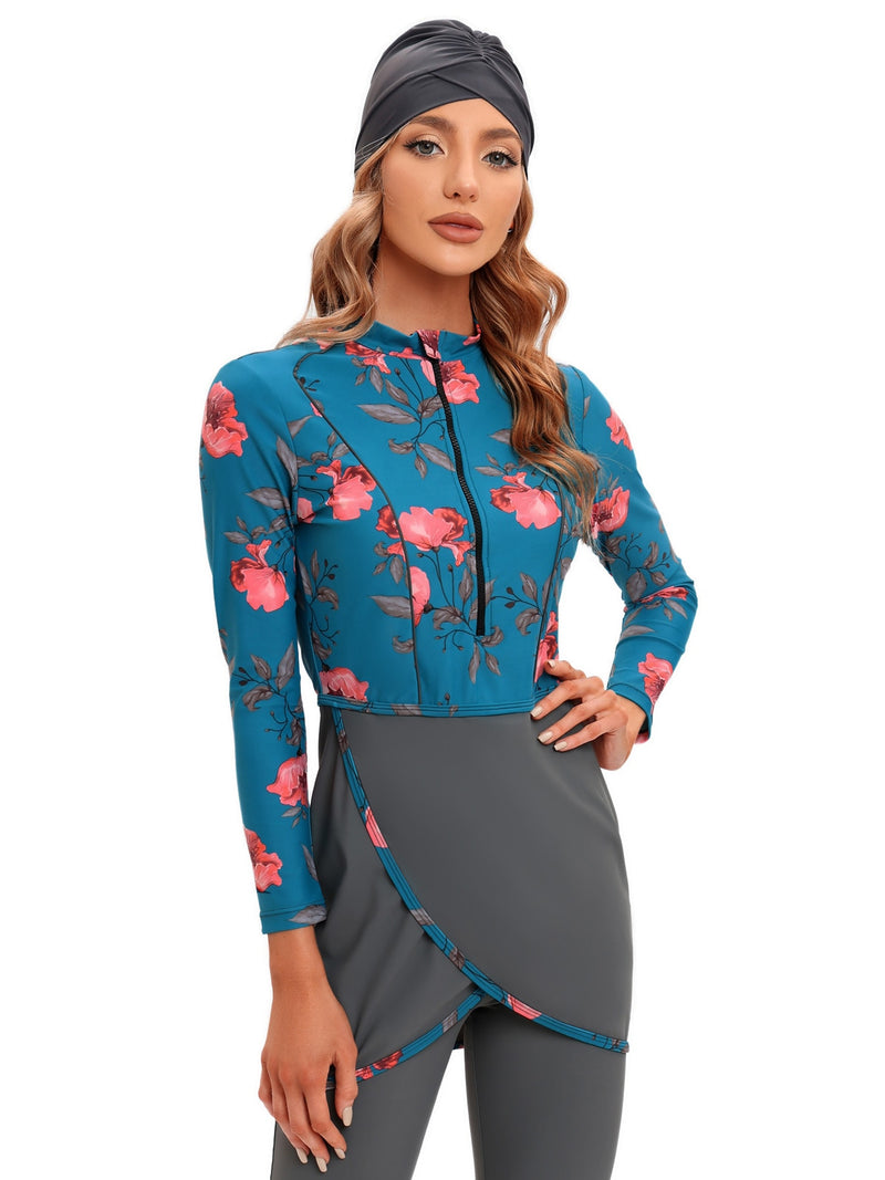 Blue burkini bathing suit with pink petal floral accents and attached gray skirt.