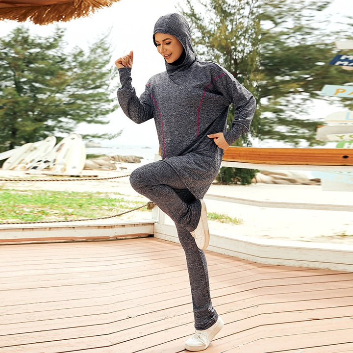 muslim girl working out with gray Modest Gym Set