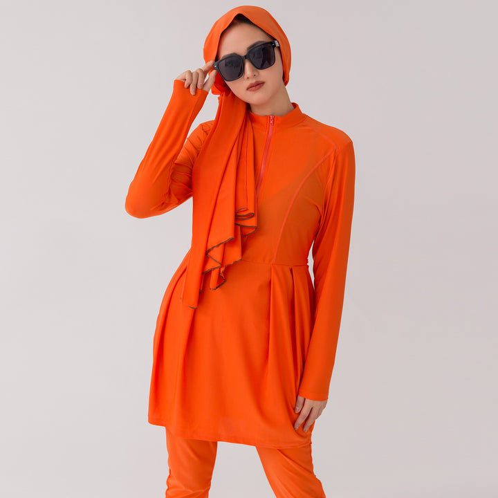 Side view of Muslim woman wearing burkini at the beach